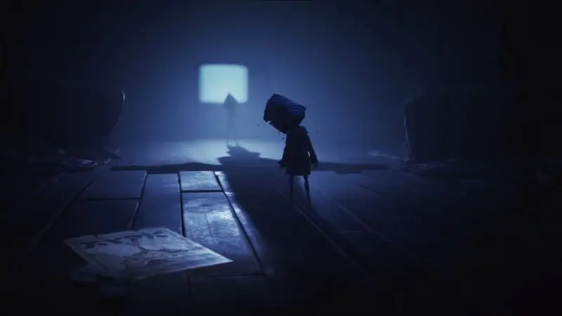 Six standing alone in a dark hallway in Little Nightmares